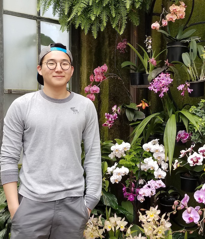 photograph of Jino Chough and orchids